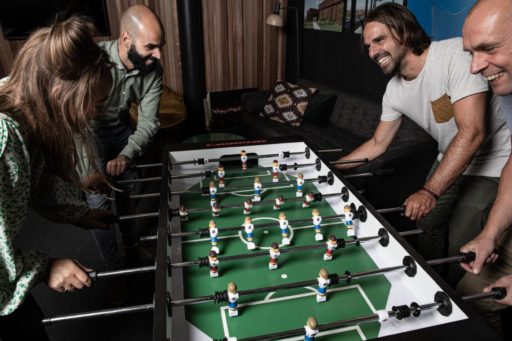 Table football with team at the office - Carl Stahl