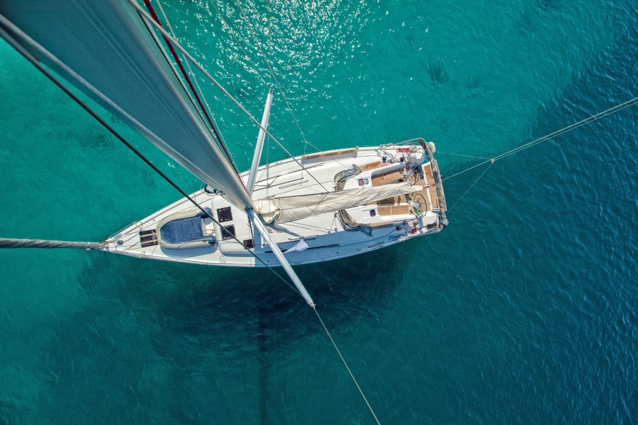 View from high angle of sailing boat. Aerial photography of ship